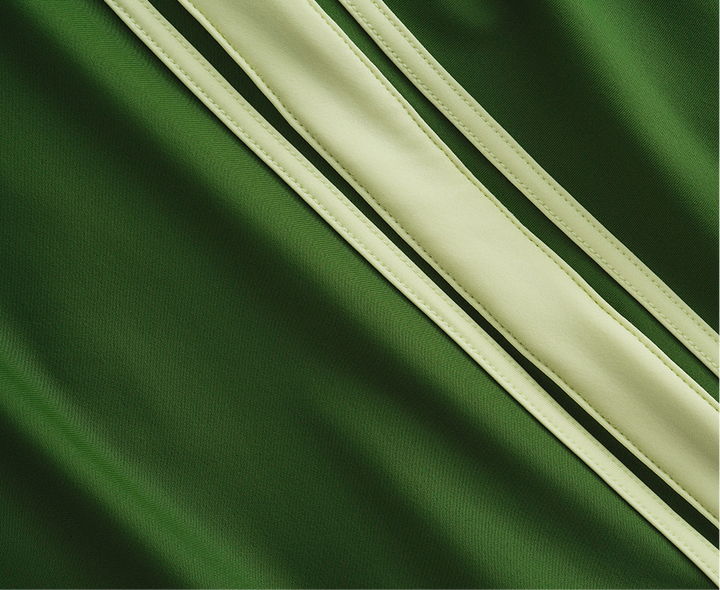 Green fabric with three diagonal light green stripes.