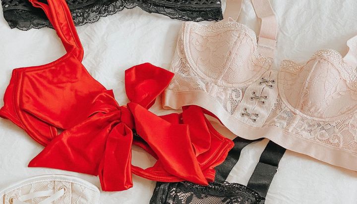 Lace and satin lingerie sets in red, black, and nude colors.