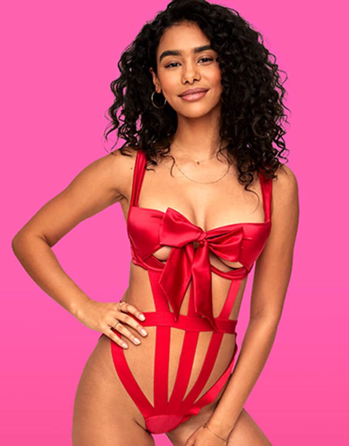 red ribbon lingerie bodysuit with bow quarter cup bra