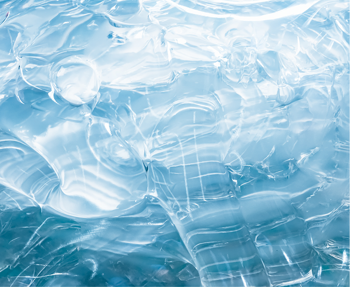 Clear blue gel with a smooth, glossy, and rippled texture.